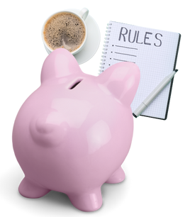 Pink piggy bank with a cup of coffee and a notebook with Rules written across the top of the page.